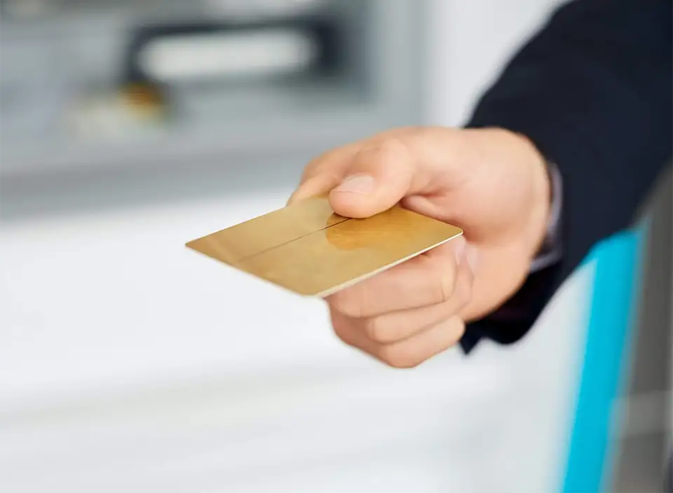 Transactions made simple. Closeup shot of an unidentifiable businessman holding out a credit card.